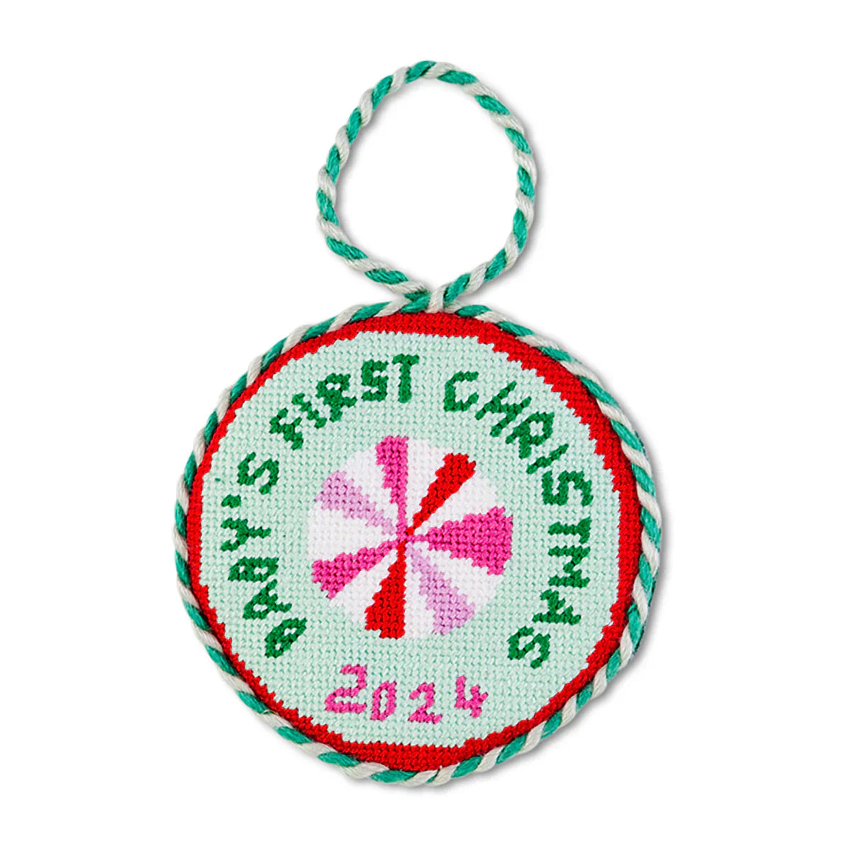 Needlepoint ornament for baby's first Christmas with velvet backing and hanging loop.