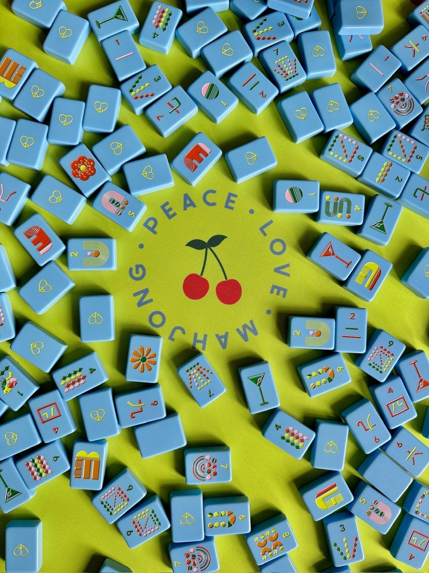 mod French blue mahjong tiles with retro motifs on vibrant surface