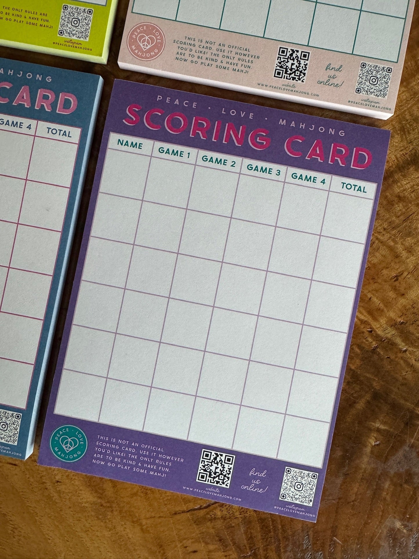 Mahjong Scoring Notepad with colorful scoring grid, 5x7 size, 50 sheets.