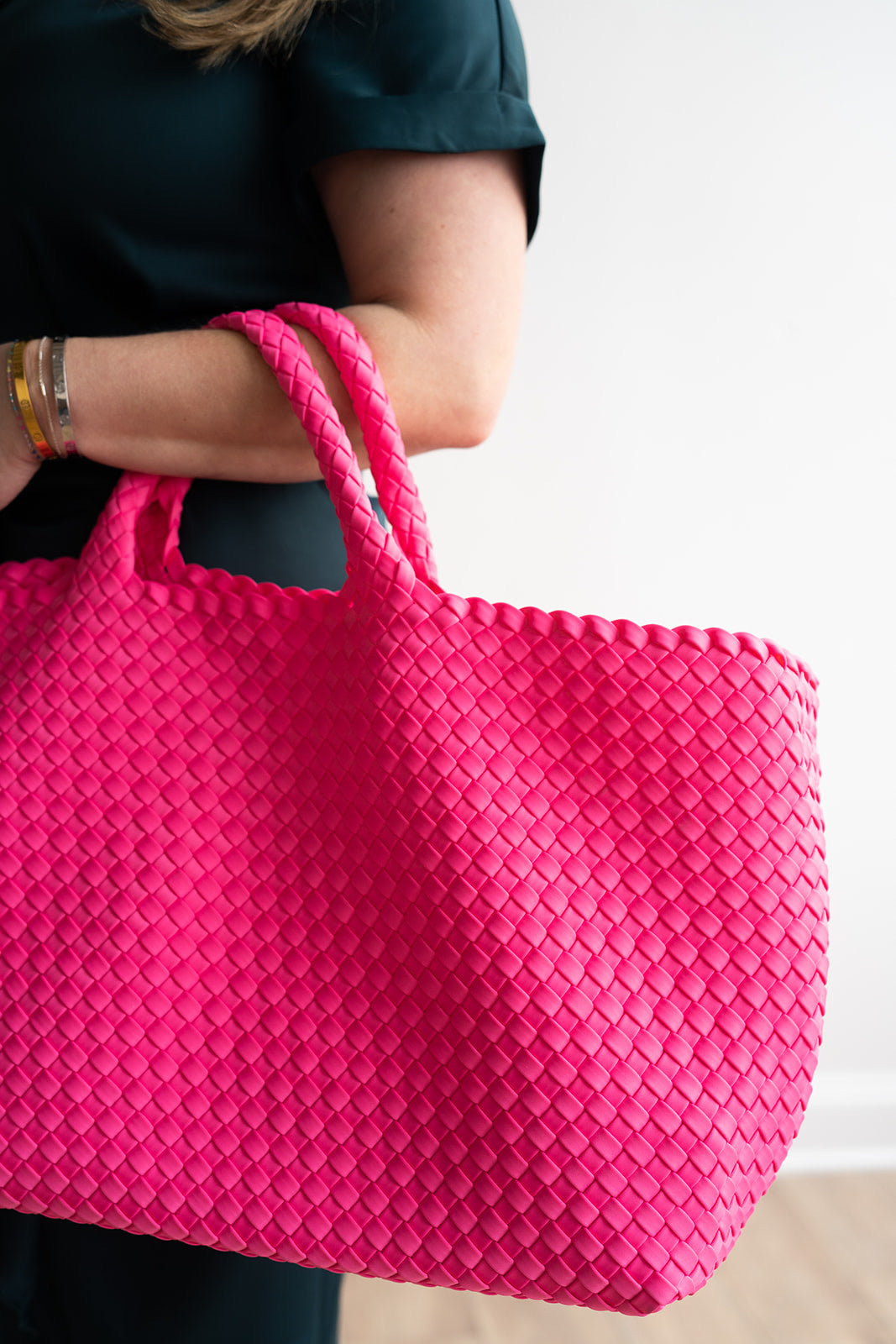 Woven Mahjong Carryall bag in bright pink, crafted from durable neoprene with a stylish design.