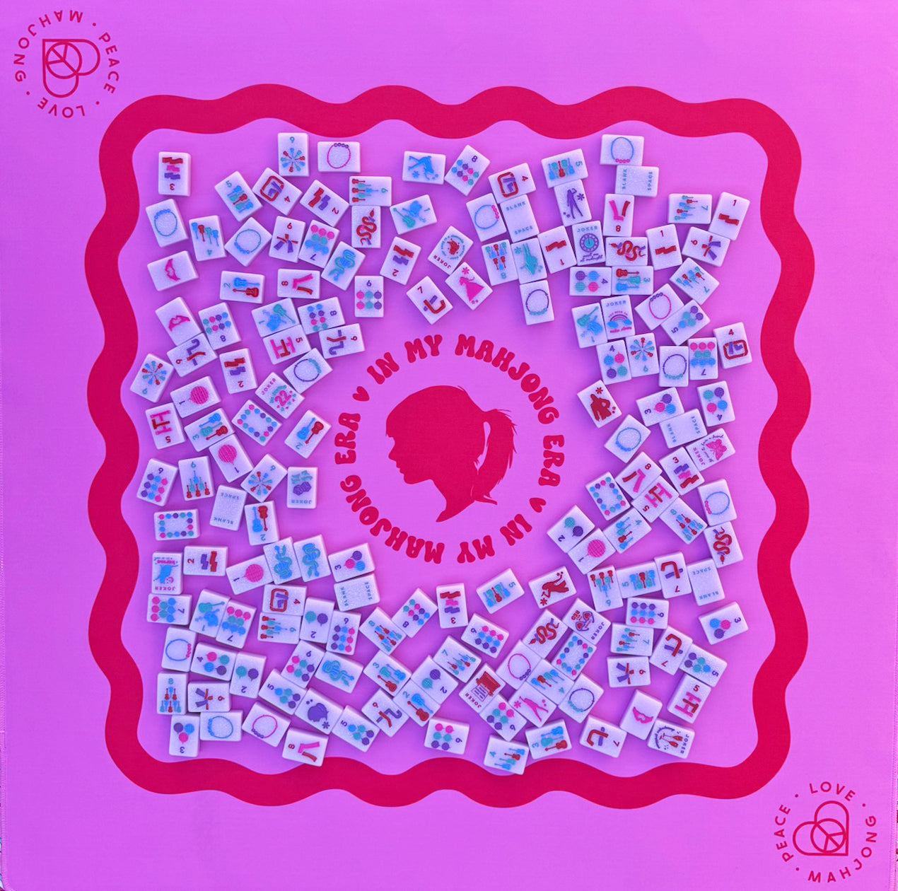 Colorful Taylor's Tiles Mahjong set on purple mat with intricate designs.