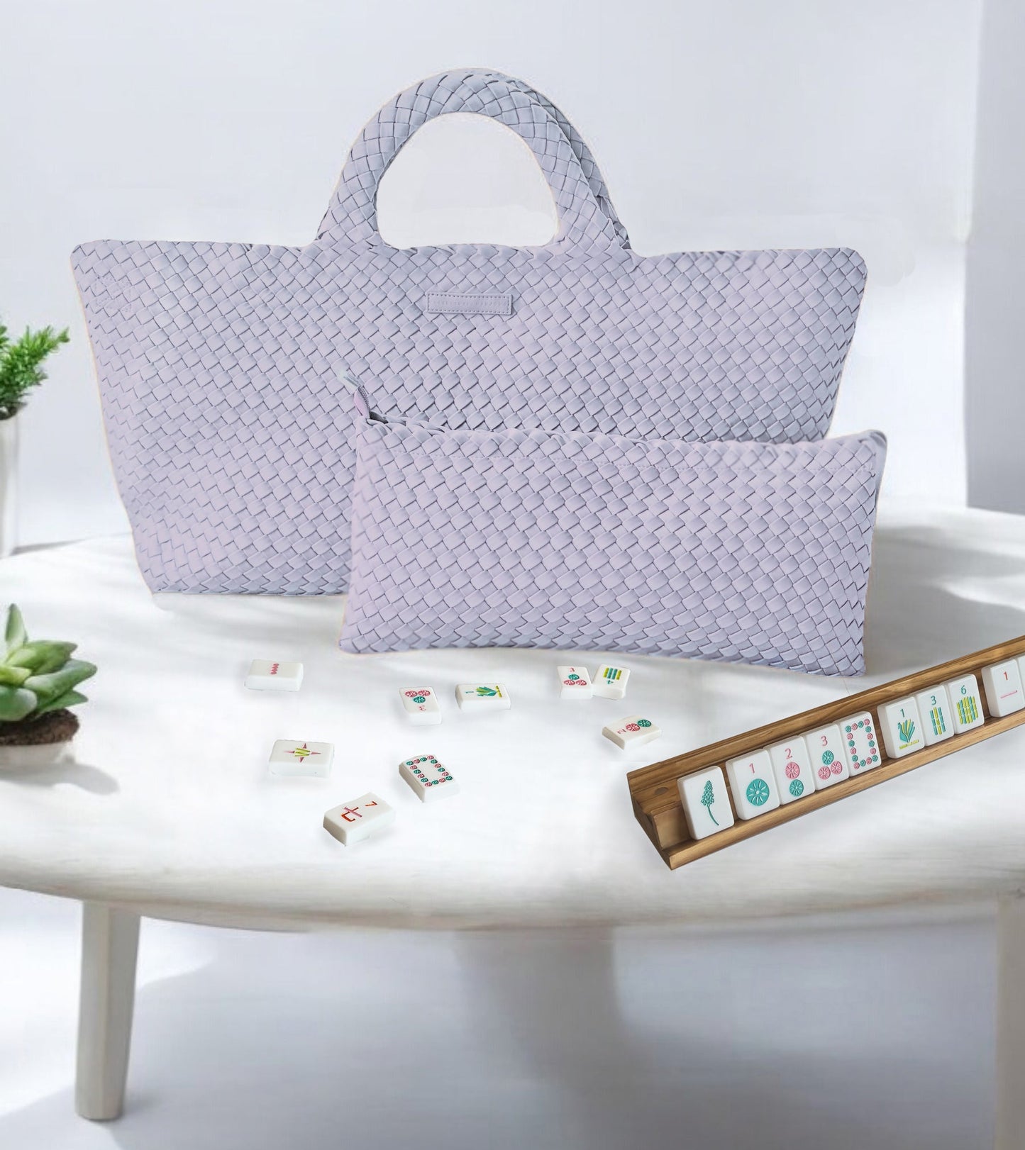 woven mahjong carryall bag with matching pouch in lavender displayed with tiles