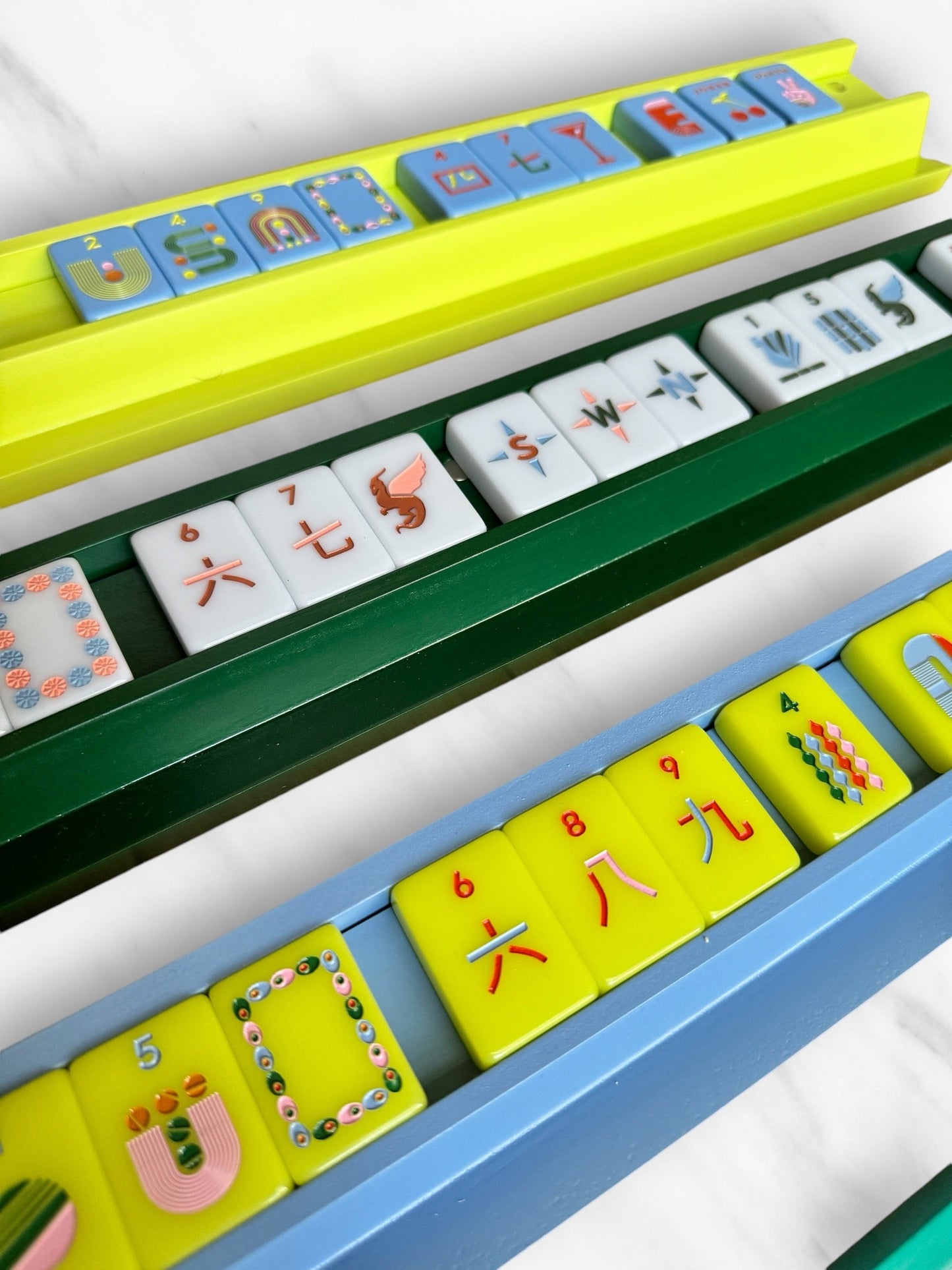 Mahjong racks and pushers set of 4 in vibrant colors.